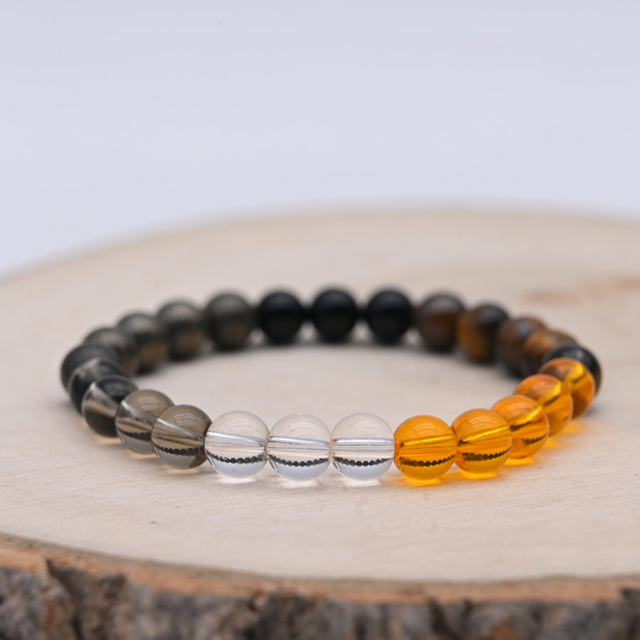 Bracelet Alchimie Opportunités et Réussite en pierres naturelles de 8 mm, composé de Citrine jaune, Pyrite grise métallique, Obsidienne noire, Cristal de Roche transparent, Quartz Fumé brun et Œil de Tigre.