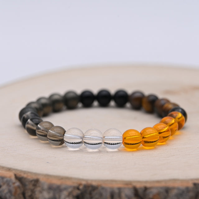 Bracelet Alchimie Opportunités et Réussite en pierres naturelles de 8 mm, composé de Citrine jaune, Pyrite grise métallique, Obsidienne noire, Cristal de Roche transparent, Quartz Fumé brun et Œil de Tigre.